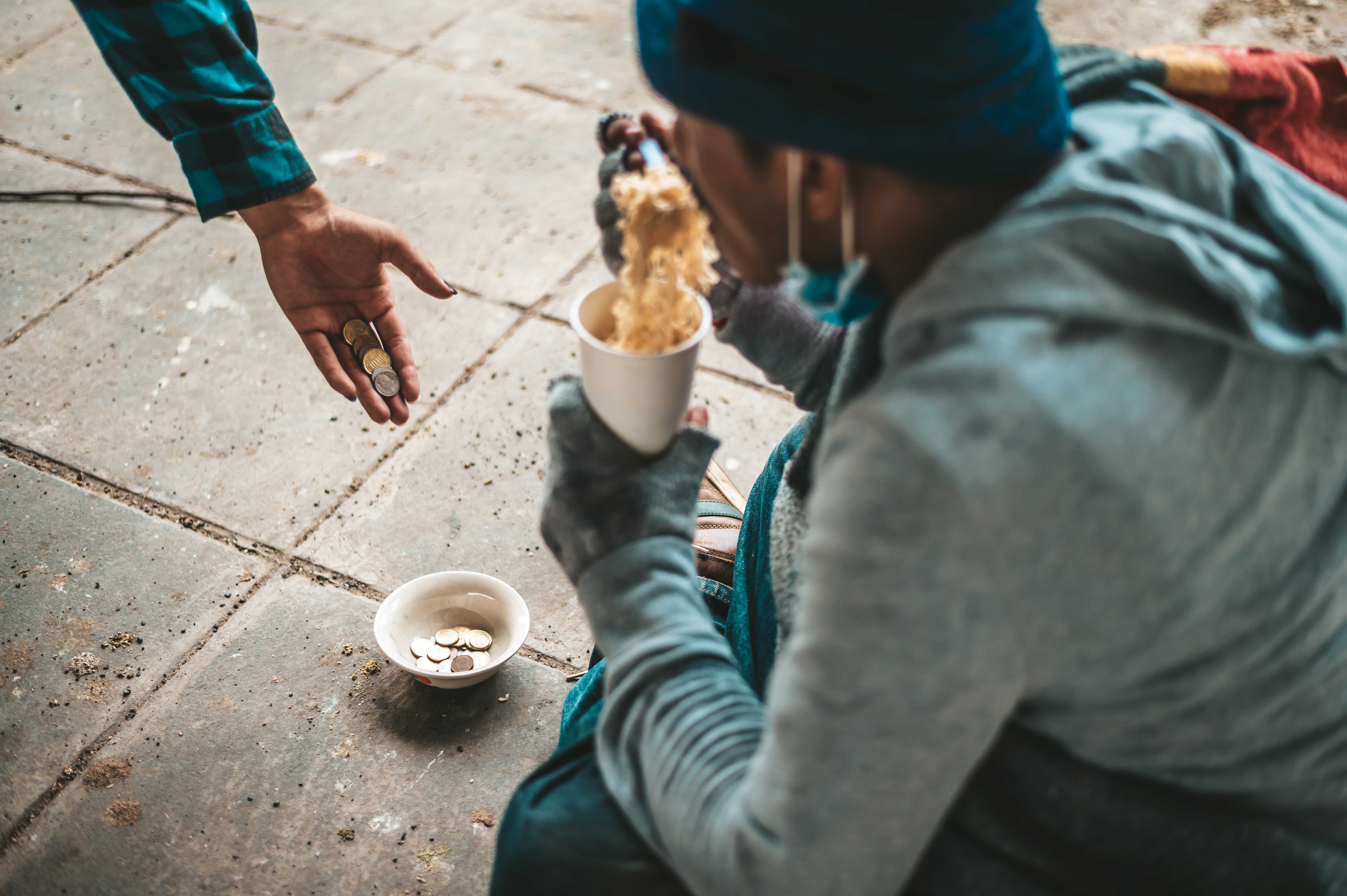 beggars-sat-wrapped-cloths-eating-noodles.jpg