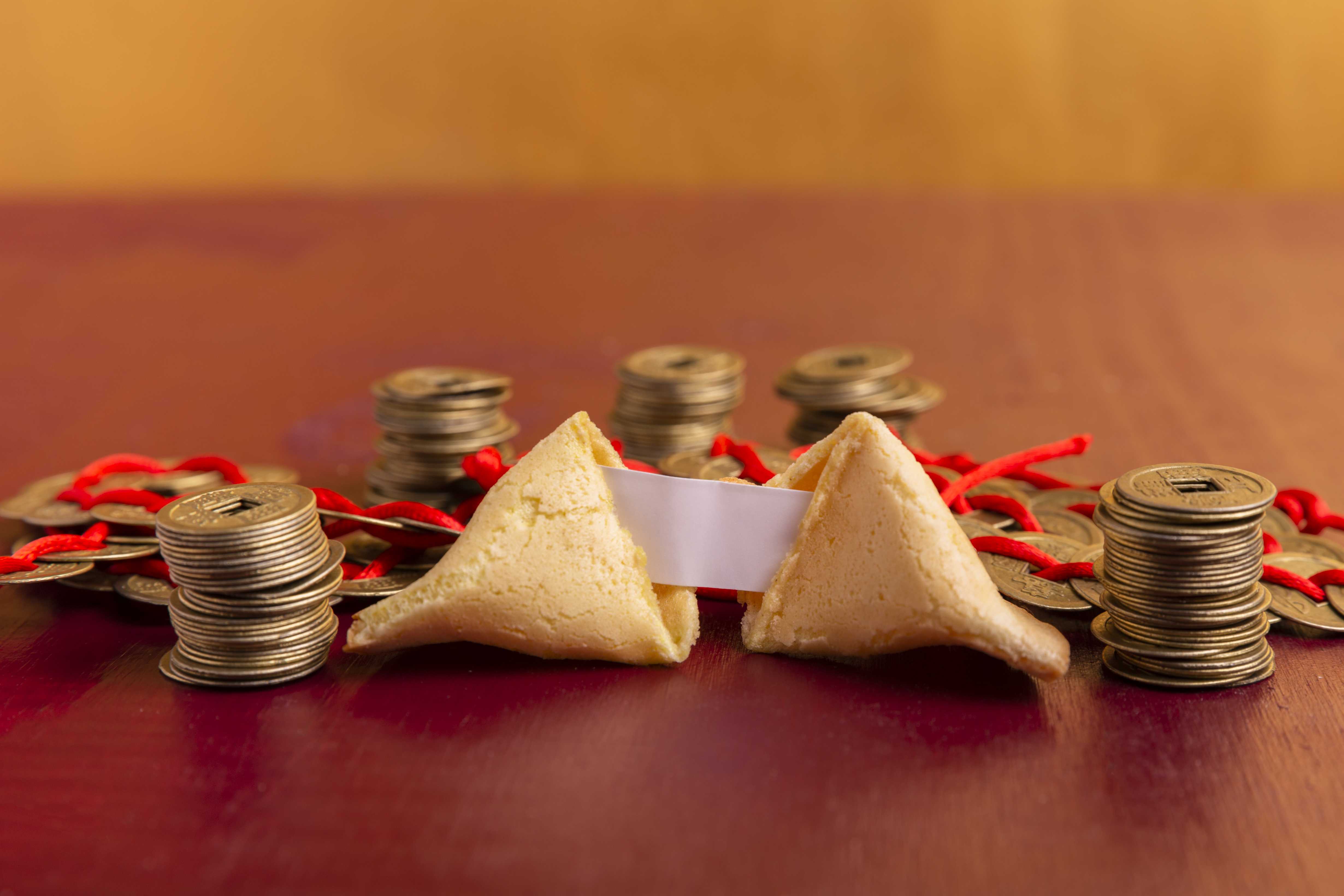 close-up-chinese-new-year-fortune-cookie-with-coins.jpg