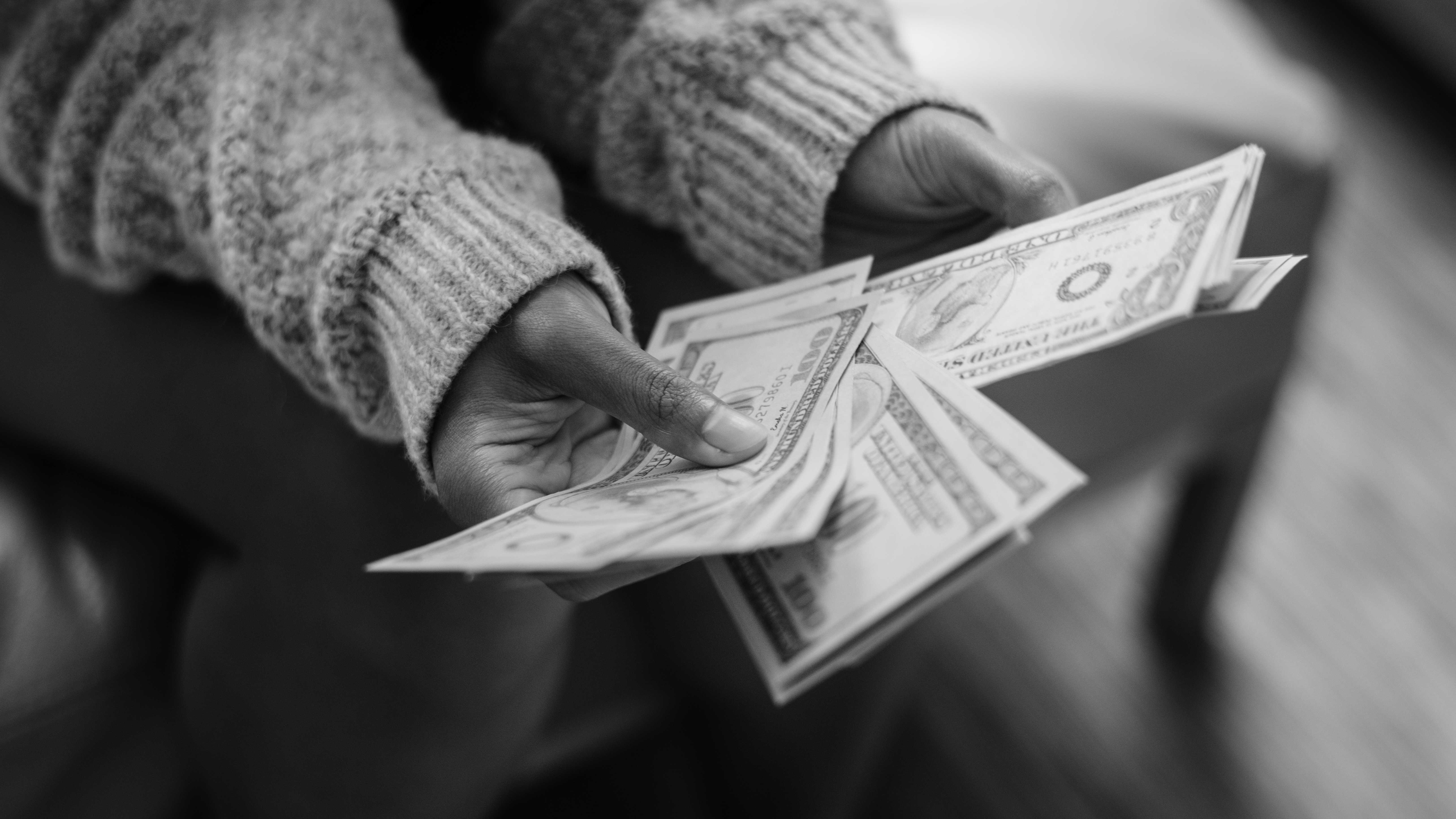 closeup-woman-counting-money.jpg