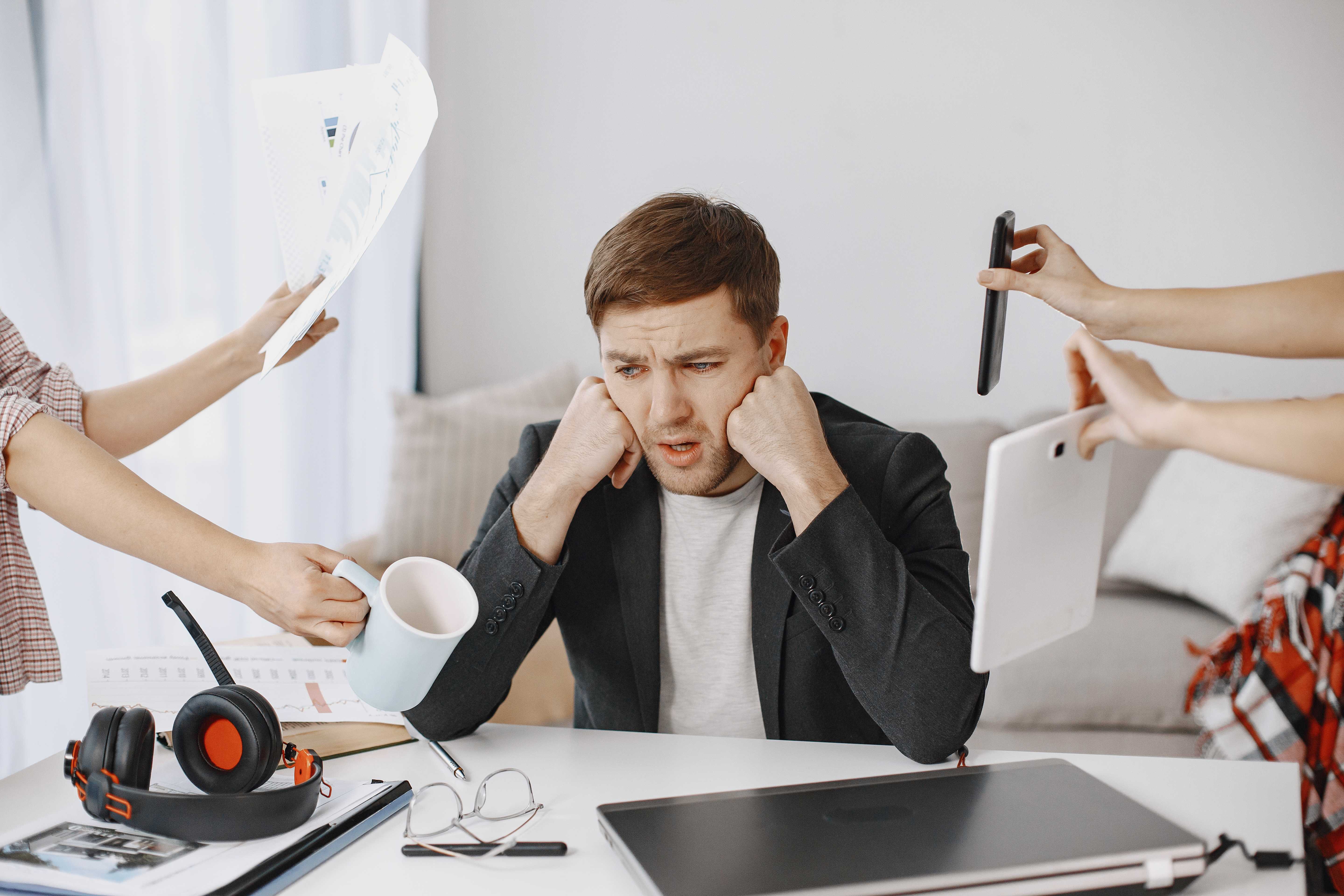 man-sitting-living-room-home-sad-man-tired-from-work.jpg