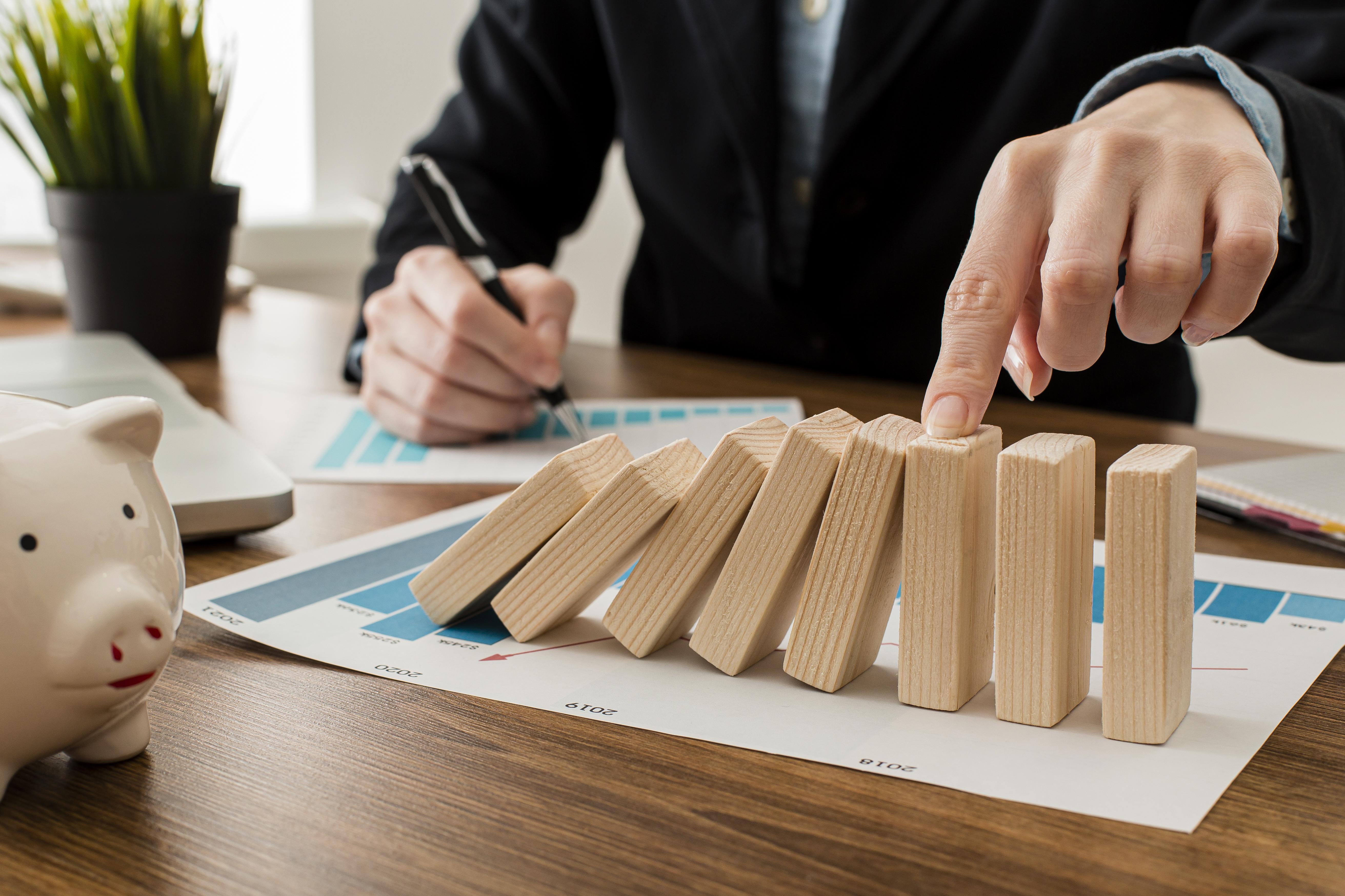 businessman-at-the-office-with-wooden-blocks.jpg